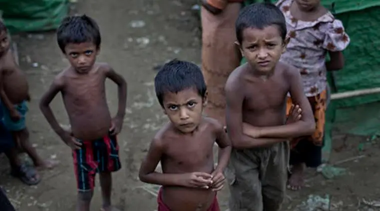 Children looking toward the camera in their neighbourhood